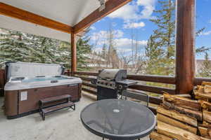 Exterior space featuring grilling area and a hot tub