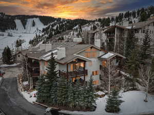 Snowy aerial view featuring a mountain view