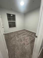 Unfurnished room with carpet floors