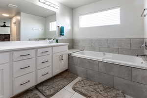 Mater bathroom, custom tile flooring & bath surround.