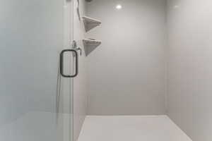 Master shower with euro glass door.