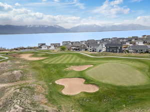View of back of home from hole on golf course.
