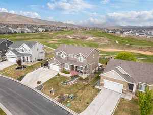 Birds eye view of property with a residential view, a mountain view, and golf course view