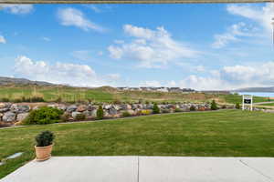 View of yard featuring a water and mountain view