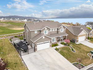 View of front of property featuring a gate, fence, stucco siding, and a residential view