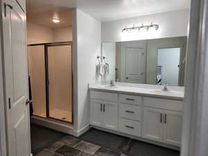 Bathroom with vanity and walk in shower