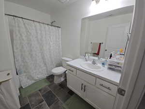 Bathroom with vanity and toilet