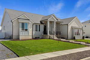 View of front of property featuring a front lawn