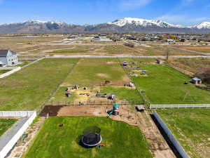 Birds eye view of property with a mountain view and a rural view