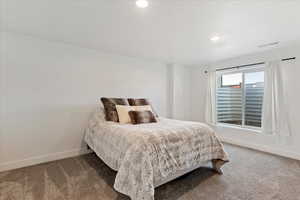 Bedroom with carpet flooring