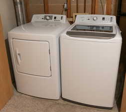 Washroom with washer and clothes dryer