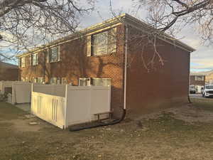 View of home's exterior with a yard