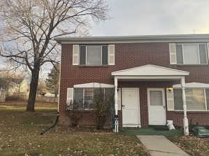 View of front of property with a front lawn