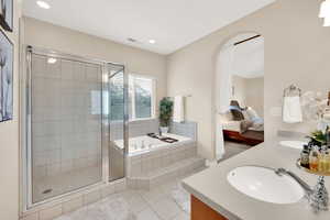 Master Bath features double vanity, separate bath and shower, jetted tub