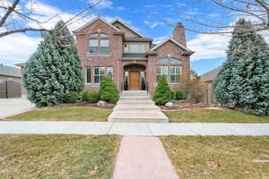 View of front of property with a front yard