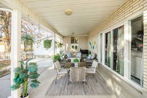 Deck featuring an outdoor living space and a patio area