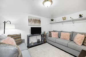 Living room featuring a textured ceiling