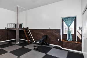 Workout room with brick wall