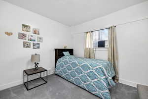 View of carpeted bedroom