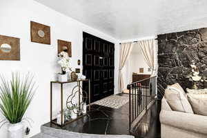 Entrance foyer featuring a textured ceiling