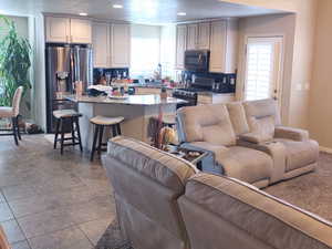 Living room featuring light tile patterned floors