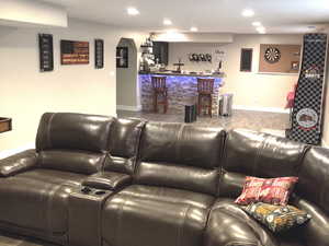 Home theater room featuring indoor bar