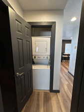 Laundry area featuring stacked washer and dryer