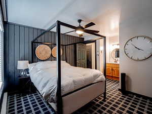 Master bedroom with carpet, ceiling fan, ensuite bath, and sink