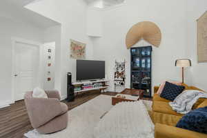 Living room featuring dark hardwood / wood-style flooring