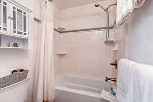 Extra deep bath tub with subway ceramic tile to ceiling