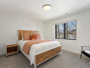 Bedroom with dark carpet