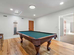 Rec room with wood-type flooring and billiards