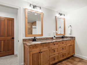 Bathroom with vanity, curtained shower, and tile patterned floors