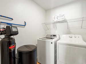 Laundry area with washing machine and clothes dryer