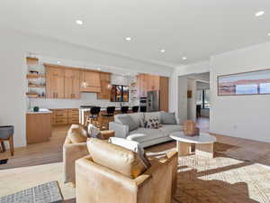 Living room with light hardwood / wood-style flooring