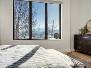 Bedroom with a mountain view and hardwood / wood-style floors