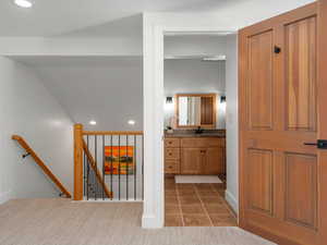 Interior space with dark carpet and sink