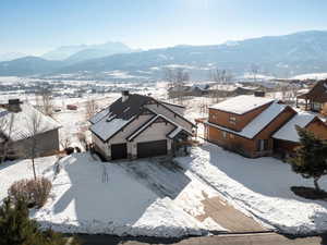 Snowy aerial view with a mountain view