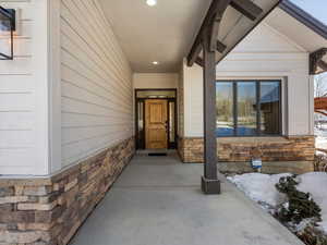 View of snow covered property entrance