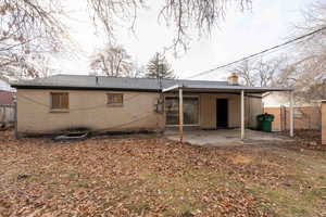 Rear view of house with a patio area