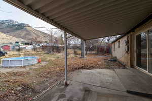 View of patio /gradual sloping terrain? a mountain view