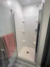 Master bathroom featuring an enclosed shower and tile patterned floors