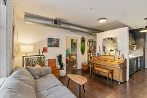 Living room with dark hardwood / wood-style floors