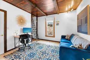 Tiled office space/2nd bedroom with wood ceiling and beam ceiling