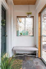 Sunroom / solarium featuring wooden ceiling