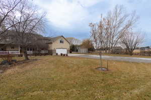 View of yard featuring a storage shed