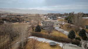 Birds eye view of property with a mountain view