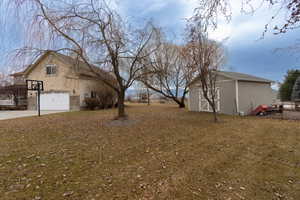 View of yard with a garage