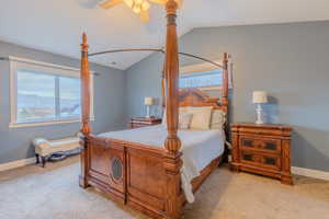 Bedroom featuring light carpet, a mountain view, vaulted ceiling, and ceiling fan