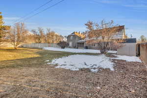 View of yard with a storage unit